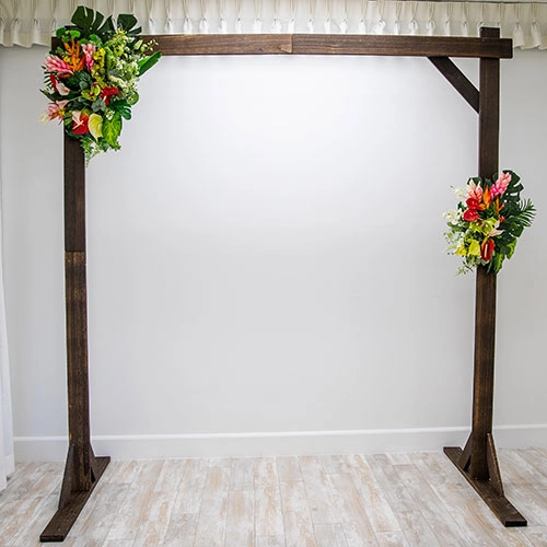 Wooden wedding arch with floral decorations