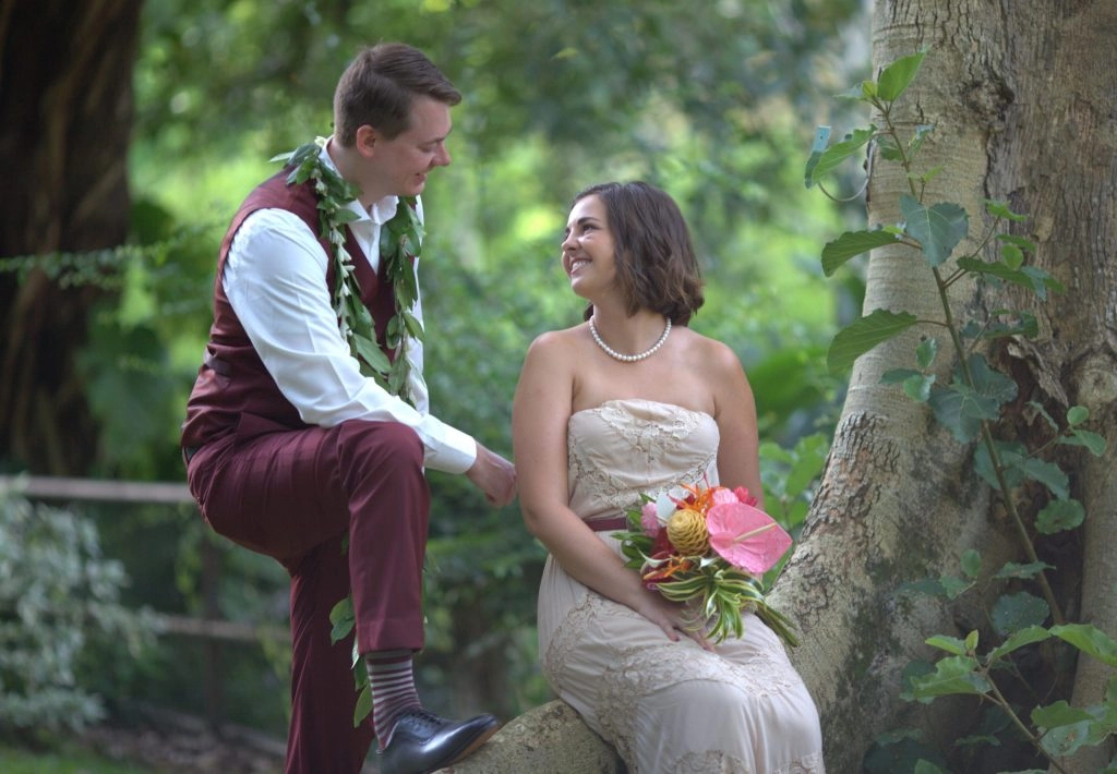 Bride and groom seated outdoors