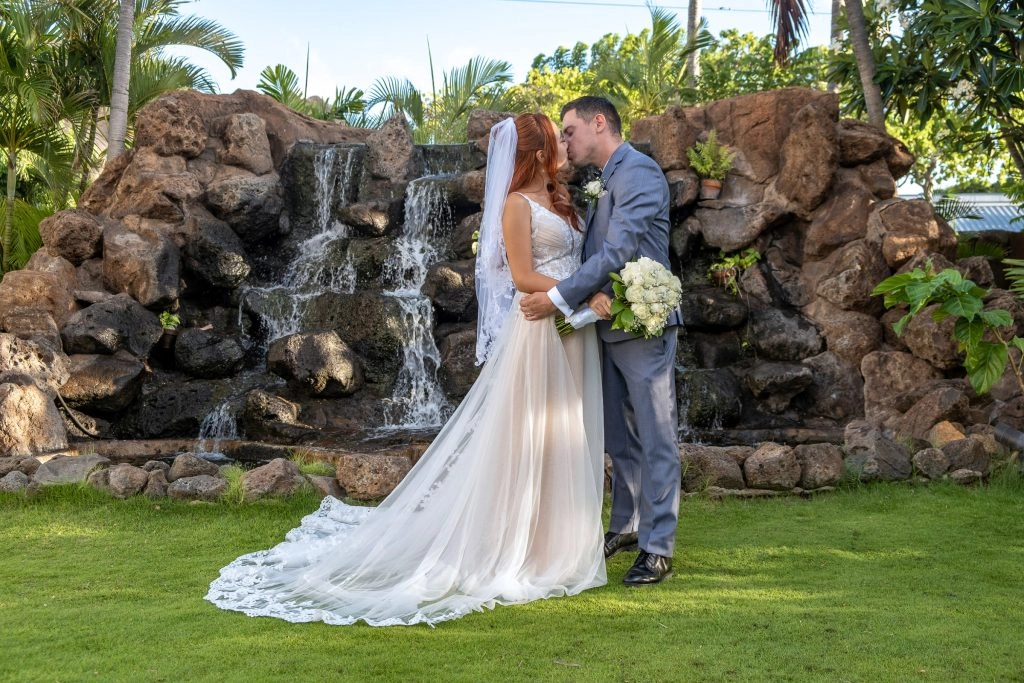 Garden waterfall wedding couple
