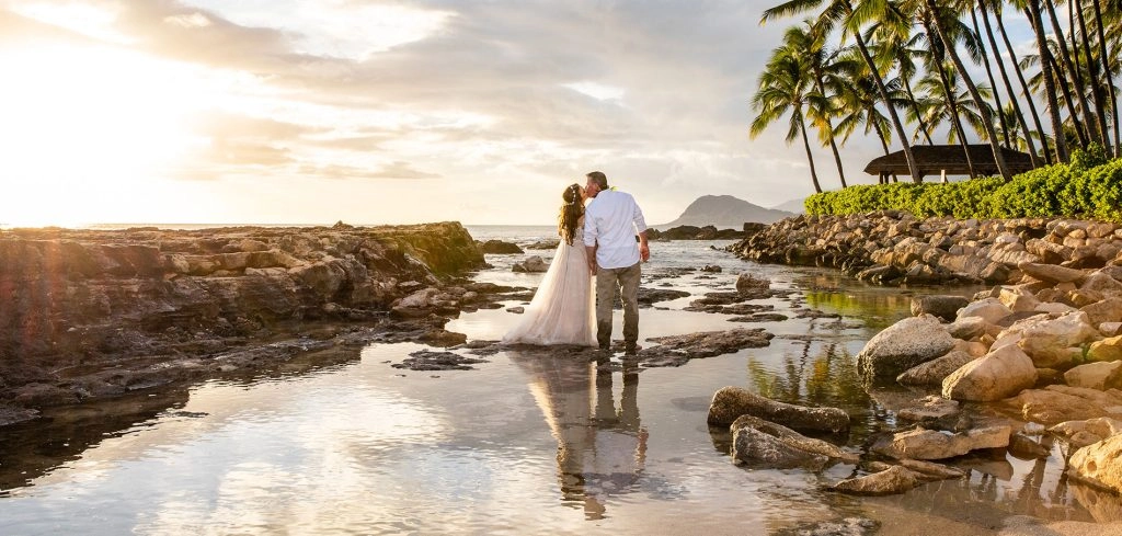 Beach wedding couple at sunset