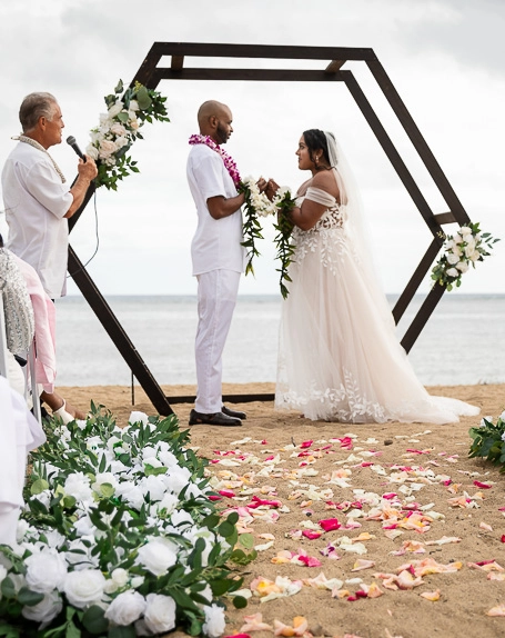 Beach wedding ceremony with bride and groom