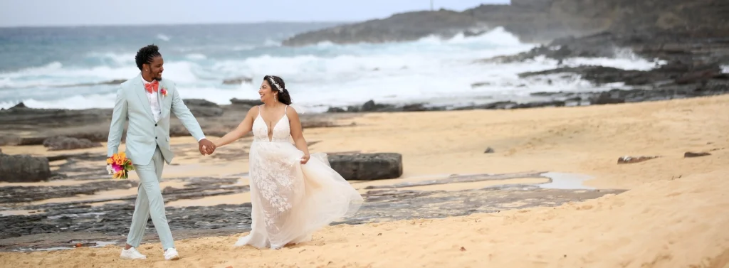 Bride and Groom Walking on Sandy Beach Hawaii